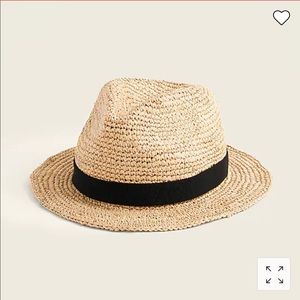 Packable straw hat no tags but never worn.
